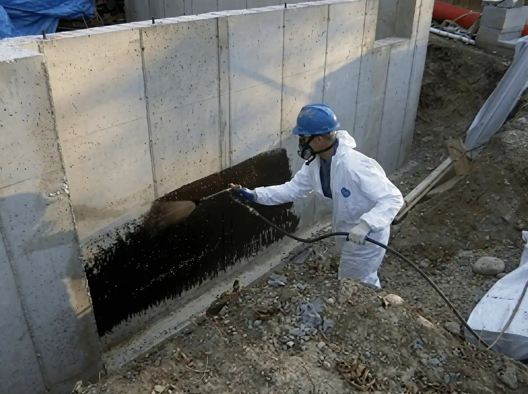 Professional waterproofing the exterior walls of the basement in Pueblo, CO