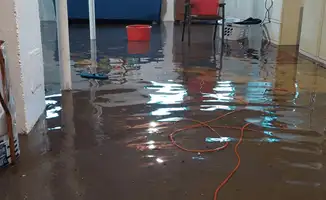 Basement with boiler, cabinets and washing machine completely flooded in Pueblo, CO